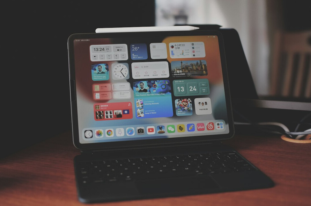 Tablet displaying data charts and reports on a desk